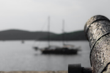 old canon pointing at boat at Korcula