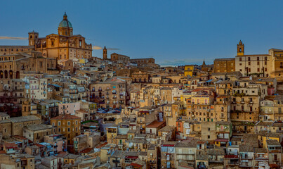 Hillside town in Sicily with golden light
