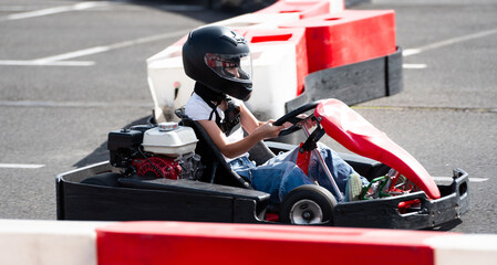 Kid Driving Fast Go Kart By Racing Track, Extreme Entertainment Park