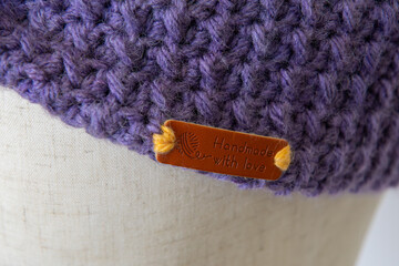 knitting needles and yarn with purple crochet 