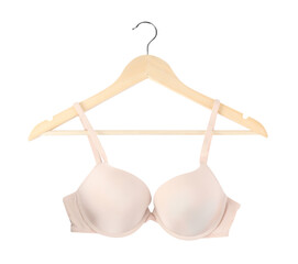 Beautiful beige bra on hanger against white background