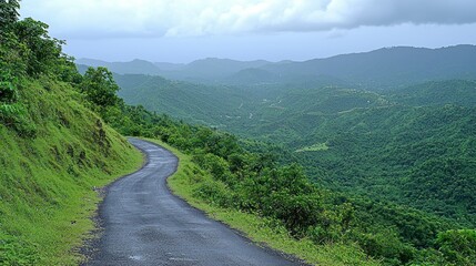 Fototapeta premium Winding mountain road, scenic valley view, travel