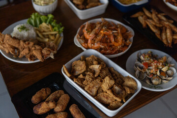 Various dishes with shrimp and seafood served on a table