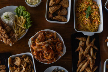 Various dishes with shrimp and seafood served on a table