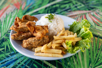Brazilian dish made of fish with rice and fries