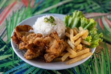 Brazilian dish made of fish with rice and fries