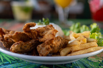 Brazilian dish made of fish with rice and fries