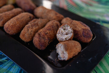 crispy and soft codfish fritters, fried Portuguese dish