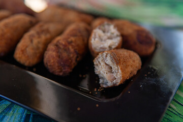 crispy and soft codfish fritters, fried Portuguese dish