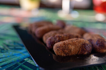 crispy and soft codfish fritters, fried Portuguese dish