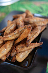 portion of small manjuba delicious breaded and fried dish