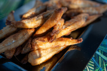 portion of small manjuba delicious breaded and fried dish