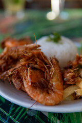 Brazilian dish made with garlic and oil shrimp with rice and potatoes, everyday food