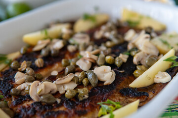 Baked fish with mushrooms and capers