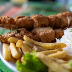 Brazilian dish made with rice, French fries and breaded meat
