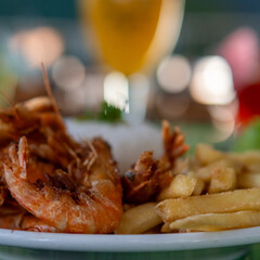 Brazilian dish made with garlic and oil shrimp with rice and potatoes, everyday food