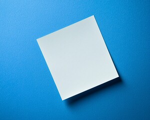 Blank white sticky note on blue background.