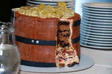 February 23, 2025 - Belgrade, Serbia. Eighteenth birthday cake in the shape of a barrel with two...