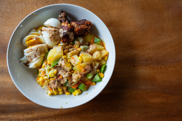Healthy vegetable and egg salad on plate wooden table