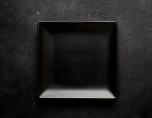 Minimalist Empty Black Plate on Dark Stone Surface Top View