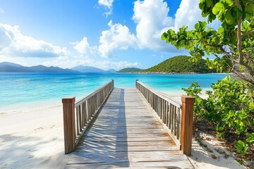 Obraz premium Wooden boardwalk leads to tropical beach, island view