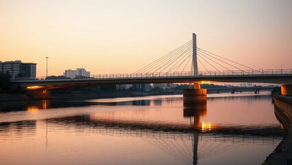 Fototapeta premium A sleek, modern bridge spanning a calm river, with minimalistic design elements illuminated by the l