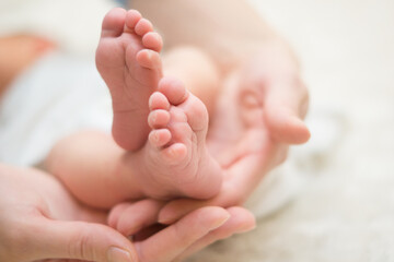 Precious Newborn Baby Feet Tenderly Cradled in Parent's Loving Hands