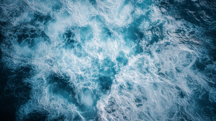 Beautiful aerial view of ocean waves with white foam in the turquoise sea, flat lay