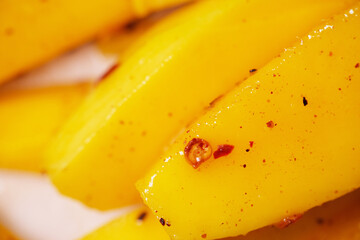 Close up of fresh Thailand mango mixed with dried chili,sugar and salt