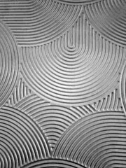 swooped and curved half moon swirl pattern with bumpy ridges