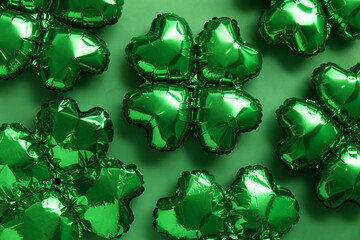 Balloons in shape of clover on green background. St. Patrick's Day celebration