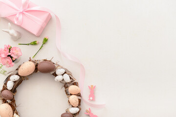 Easter wreath and sprigs of gypsophila on light background