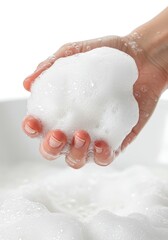 Fototapeta premium Hand Holding Luxurious White Foam, Close-Up