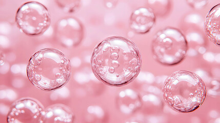 Floating bubbles create a dreamy atmosphere in a soft pink background, illustrating a whimsical and playful ambiance often found in celebrations or beauty products