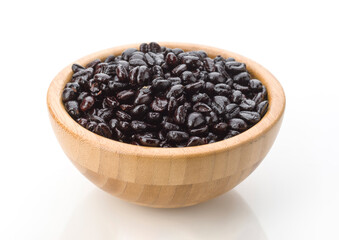 Freshly harvested black beans in a wooden bowl ready for cooking and meal preparation