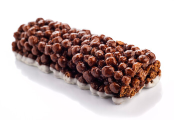 Delicious chocolate-coated snack bar with crispy rice puffs and creamy filling