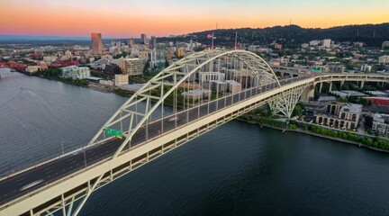 Aerial view of the Freemont Bridge over the Willamette River in Portland, OR at sunset. Traffic flows smoothly across the bridge. Oregon, USA