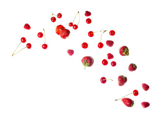 Flying fresh strawberries with raspberries and red cherries on white background