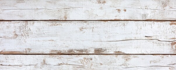 Fototapeta premium A close-up view of a white-painted wooden wall featuring a charming small window with delicate trim.