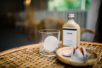Refreshing Cold Brew Coffee with Ice and Sweet Treats on Table