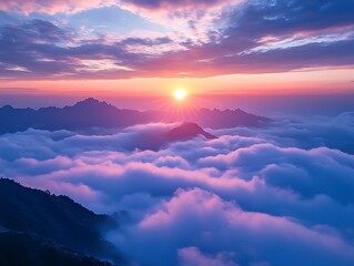 Sunrise over misty mountains