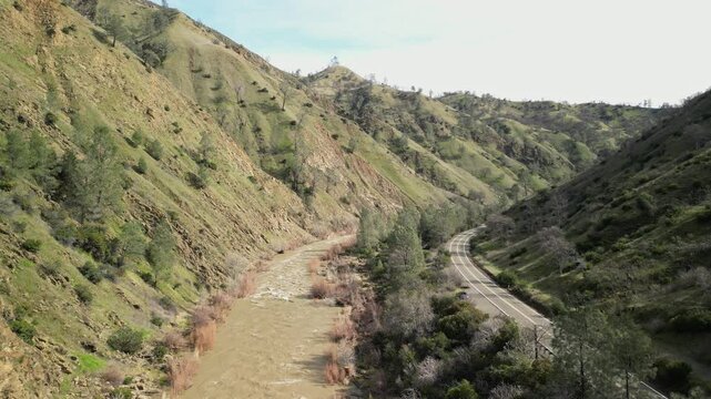 Cache Creek&rsquo;s winding course is displayed from above, offering a unique view of its natural landscape.