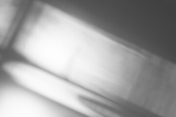 Gray shadow and light blur abstract background on white wall from window. Dark stripe grey shadows indoor in room background, monochrome, shadow overlay effect for backdrop and mockup design