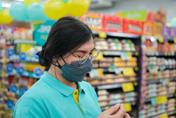 Asian woman work in supermarket or hypermarket