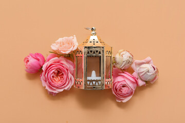 Fanoos with beautiful flowers on beige background. Ramadan celebration