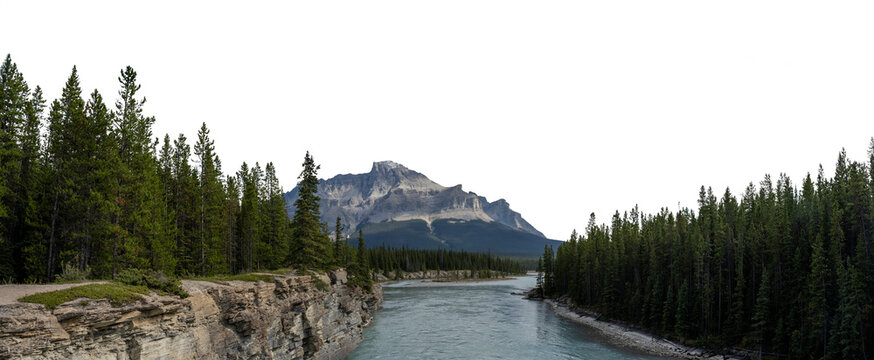 Looking along a large river surrounded by evergreen trees and a mountain in the distance with a transparent sky. . Panorama
