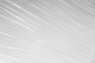 Obraz premium white or translucent plastic sheet with visible creases and folds. the transparent plastic wrap for design overlay