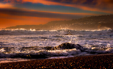 Close-up of sea splash along the shoreline of Palos Verdes Estates, CA with a background of...