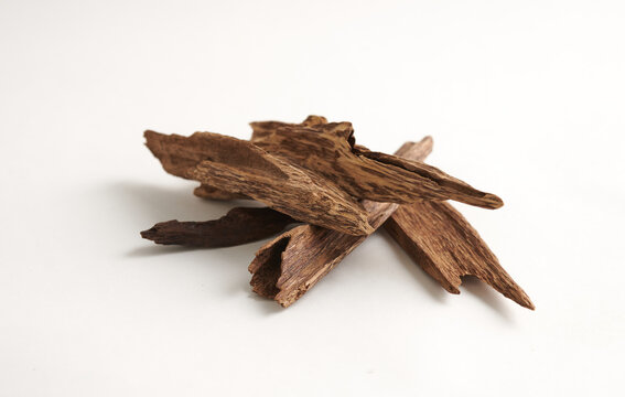 Raw Agarwood Pieces isolated on white background. Natural Fragrant Wood for Incense and Perfume