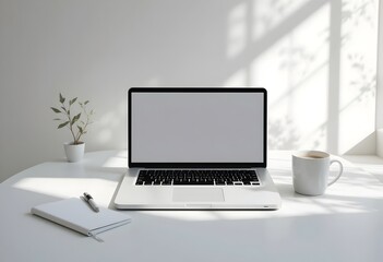 Fototapeta premium Minimalist White Desk with Laptop, Notebook, and Coffee